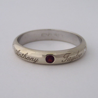 Birth ring simple half round 18K white gold diamonds ruby engraved names mommy's birth gift Daphne Meesters Jewellery Designer Goldsmith The Hague Netherlands
