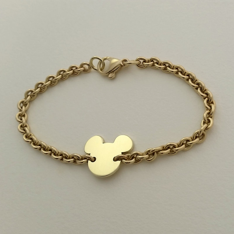 Mickey oval chains bracelet 14K yellow gold with mickey silhouette Daphne Meesters Jewellery Designer Goldsmith The Hague Netherlands