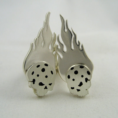 Skull with flames floorball cuff-links shiny and matte finish hinged back sterling silver Daphne Meesters Jewellery Designer Goldsmith The Hague Netherlands
