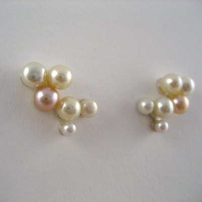 Ear climbers sterling silver pink cream and white pearls in different sizes Daphne Meesters Jewellery Designer Goldsmith The Hague Netherlands