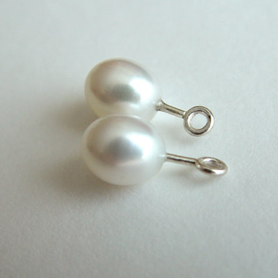 Ear jackets sterling silver white oval pearls Daphne Meesters Jewellery Designer Goldsmith The Hague Netherlands
