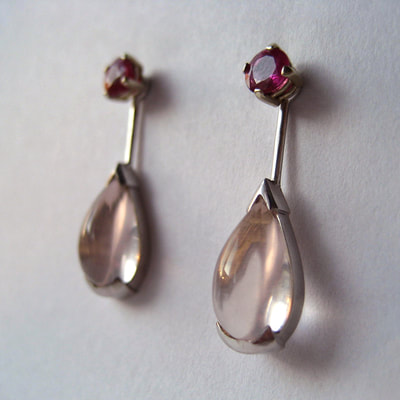 Ear studs ear jackets 14K white gold round faceted rubies cabochon rose quartz drops Daphne Meesters Jewellery Designer Goldsmith The Hague Netherlands
