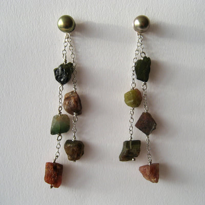 Ear studs sterling silver green pearls ear jackets dangling sterling silver long fine double chain green brown pink rough tourmaline beads Daphne Meesters Jewellery Designer Goldsmith The Hague Netherlands
