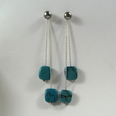 Ear studs sterling silver grey pearls ear jackets dangling sterling silver long fine double chain turquoise square beads Daphne Meesters Jewellery Designer Goldsmith The Hague Netherlands
