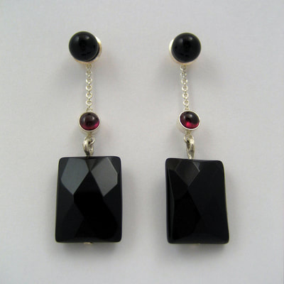 Onyx ear studs dangling ear jackets sterling silver red garnet faceted rectangle onyx Daphne Meesters Jewellery Designer Goldsmith The Hague Netherlands
