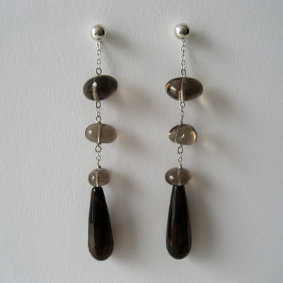 Ear studs and dangling ear jackets sterling silver fine chain brow agate drops and smokeyquartz pebble beads Daphne Meesters Jewellery Designer Goldsmith The Hague Netherlands
