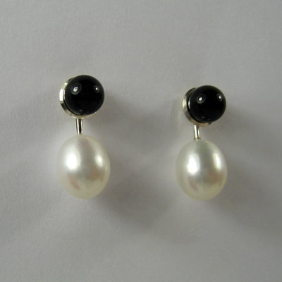 Onyx ear studs and ear jackets sterling silver white oval pearls Daphne Meesters Jewellery Designer Goldsmith The Hague Netherlands
