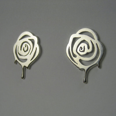 Painting the roses red Alice in wonderland exclusive collection earrings earstuds sterling silver paint dripping roses hand pierced unique piece 15 millimeters € 85,- Daphne Meesters Jewellery Designer Goldsmith The Hague Netherlands