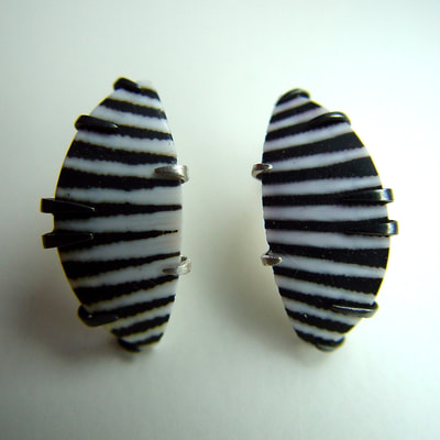 Zebra ear studs oxidized sterling silver black and white shell Daphne Meesters Jewellery Designer Goldsmith The Hague Netherlands
