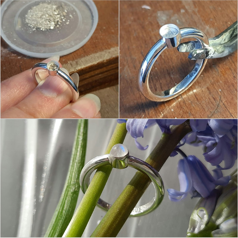 Simple delicate memorial ring with ashes of a loved one in a smal chamber underneath the moonstone Daphne Meesters Jewellery Designer Goldsmith The Hague Netherlands