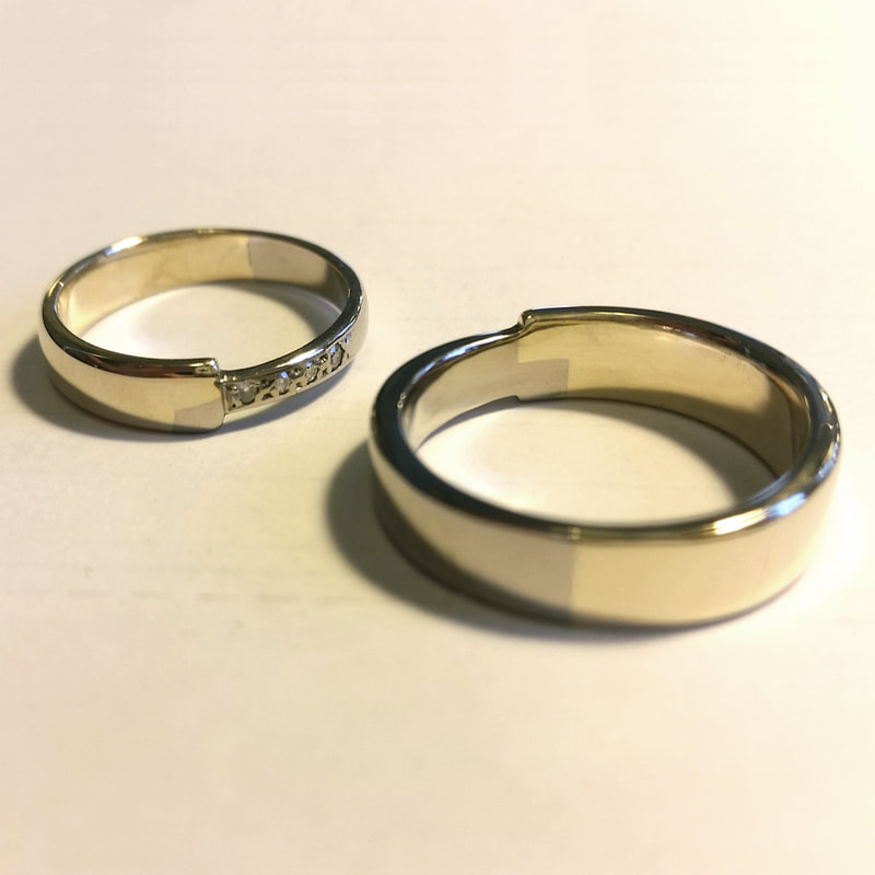 Mens wedding ring remake after a loss in order to complete the set again 14K yellow and white gold connected like a puzzle Daphne Meesters Jewellery Designer Goldsmith The Hague Netherlands