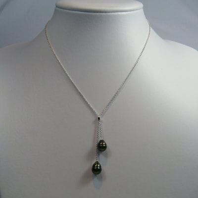 Pending necklace fine sterling silver chain with two dark green irregular drop shaped pearls asymmetrical simple elegant Daphne Meesters Jewellery Designer Goldsmith The Hague Netherlands