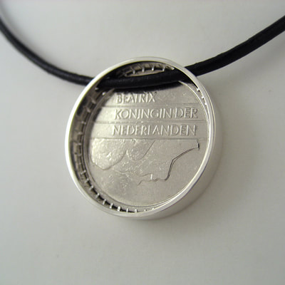 25 cents coin bezel simple modern pendant sterling silver shiny finish on black leather cord 25th birthday present Daphne Meesters Jewellery Designer Goldsmith The Hague Netherlands
