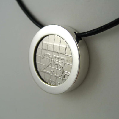 25 cents coin bezel pendant sterling silver plain shiny finish on black leather strap front view 25th birthday present Daphne Meesters Jewellery Designer Goldsmith The Hague Netherlands

