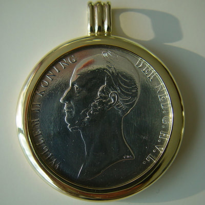 King Willem 2 coin bezel pendant 14K yellow gold shiny finish and silver coin Daphne Meesters Jewellery Designer Goldsmith The Hague Netherlands