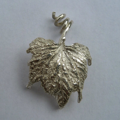 Heared it through the grapevine vine leaf  shaped pendant sterling silver Daphne Meesters Jewellery Designer Goldsmith The Hague Netherlands