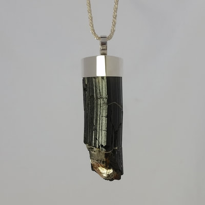 Tourmaline pendant shiny finish sterling silver and rough black tourmaline crystal on sterling silver rope necklace Daphne Meesters Jewellery Designer Goldsmith The Hague Netherlands