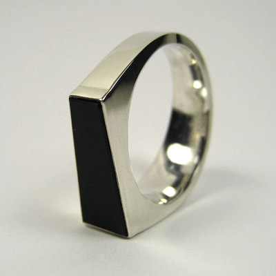 Trapezoid re-cut black onyx signet ring shiny finish sterling silver modern square Daphne Meesters Jewellery Designer Goldsmith The Hague Netherlands
