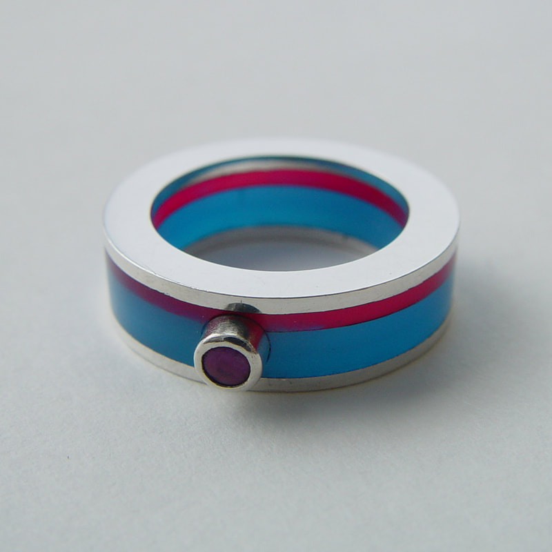 Blue and pink layers ring sterling silver pink pearl blue and pink plexiglass layers lines flat surface size 16,5 millimeters € 195,- Daphne Meesters Jewellery  Designer Goldsmith The Hague Netherlands