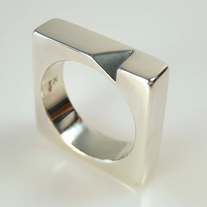 Tetrahedron ring square ring with a missing piece high gloss finish sterling silver designer goldsmith Daphne Meesters Jewellery The Hague Netherlands