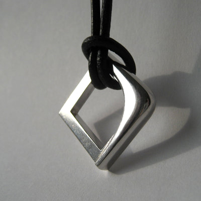 Blended contradictions men's wedding pendant open rounded square sterling silver on black leather strap alternative wedding ring Daphne Meesters Jewellery Designer Goldsmith The Hague Netherlands