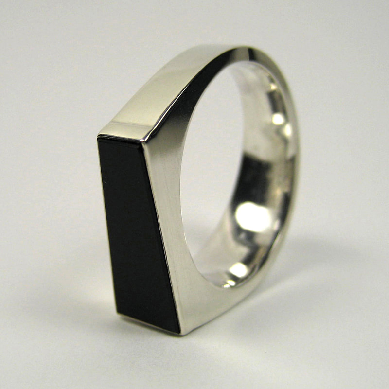 Trapezoid men's signet wedding ring with re-cut black onyx in shiny sterling silver modern square Daphne Meesters Jewellery Designer Goldsmith The Hague Netherlands