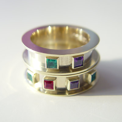 Medieval wedding bands rings contemporary wide flat high border 14K white yellow gold birthstones ruby emerald amethyst high polished handwriting engraving Daphne Meesters Jewellery Designer Goldsmith The Hague Netherlands